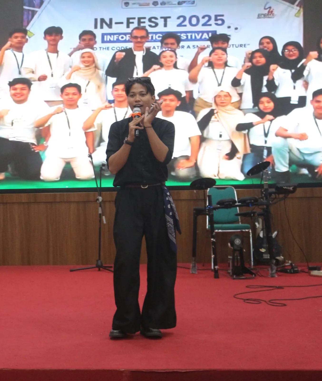 Speaking on stage at IN-FEST 2025